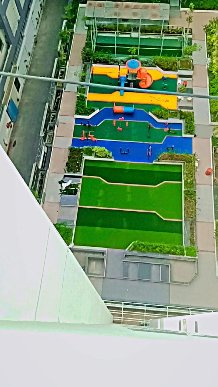 Rooftop play area finished in green and blue EPDM wet pour flooring