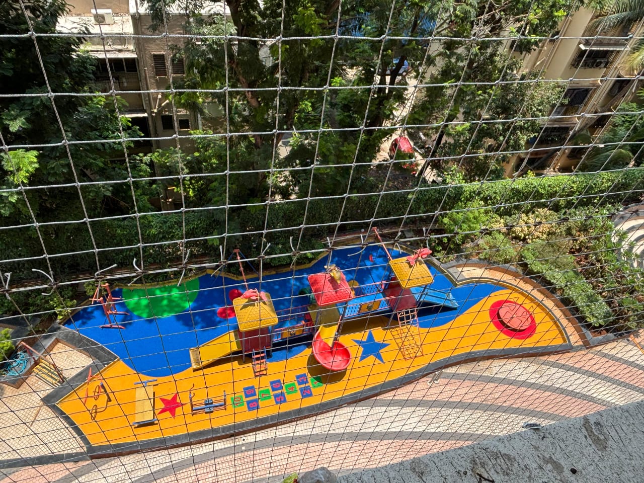 Themed EPDM wet pour play area with a boat design in blue and yellow