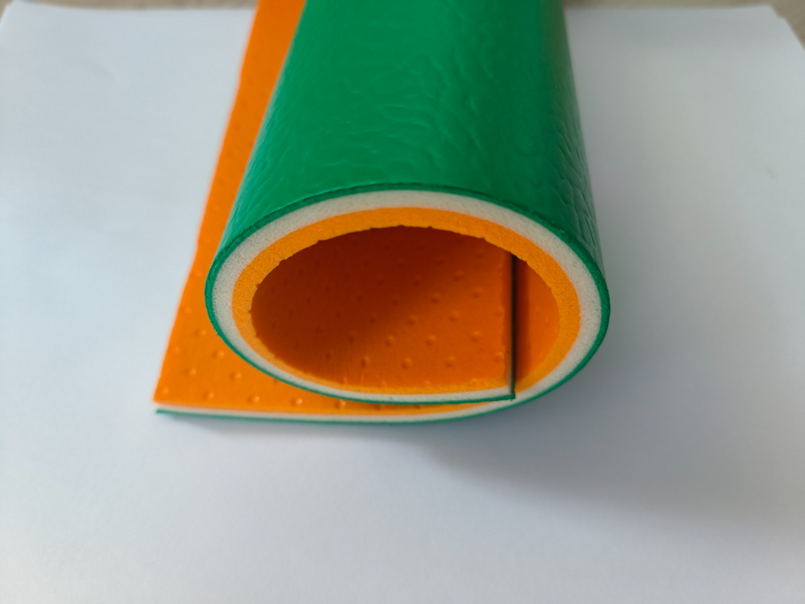 8 mm PVC vinyl roll cross-section in green showing the closed-cell foam layer