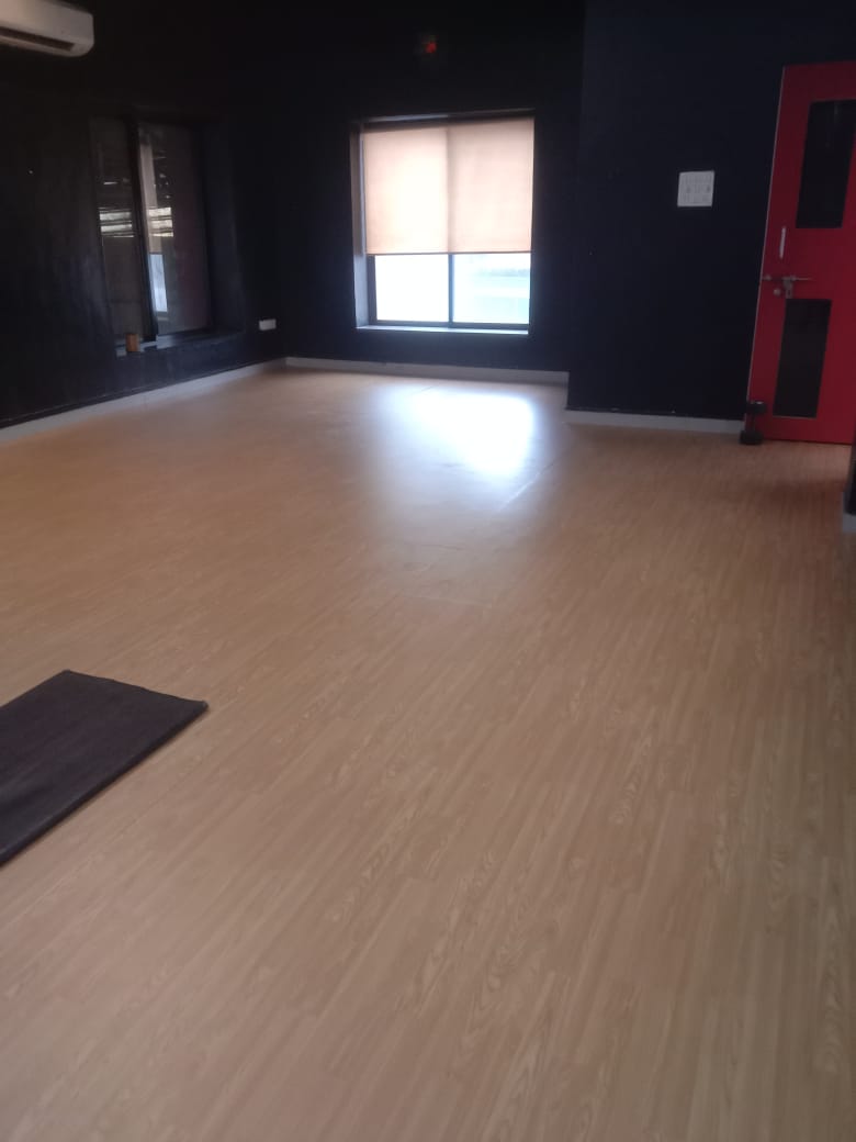 Wood finish PVC vinyl flooring in a studio with natural light