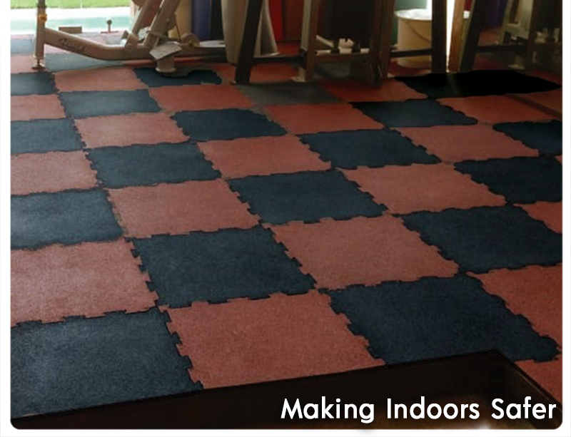 Interlocking rubber tiles in terracotta, silver grey and metallic blue on an indoor floor