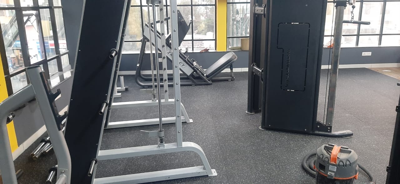 Seamless EPDM rubber roll flooring around cardio and strength equipment
